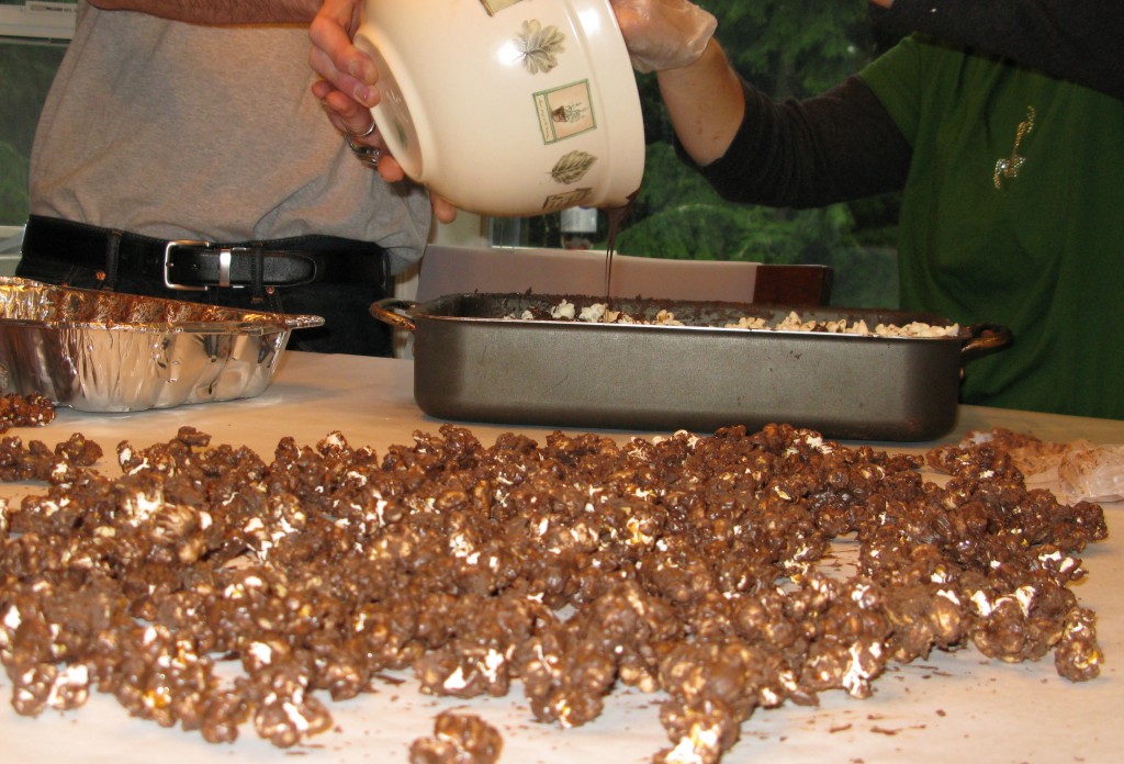 Coat the popcorn, allow to set on waxed or parchment paper.